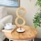 15" Brown Rattan Infinity Sculpture with White Marble Base